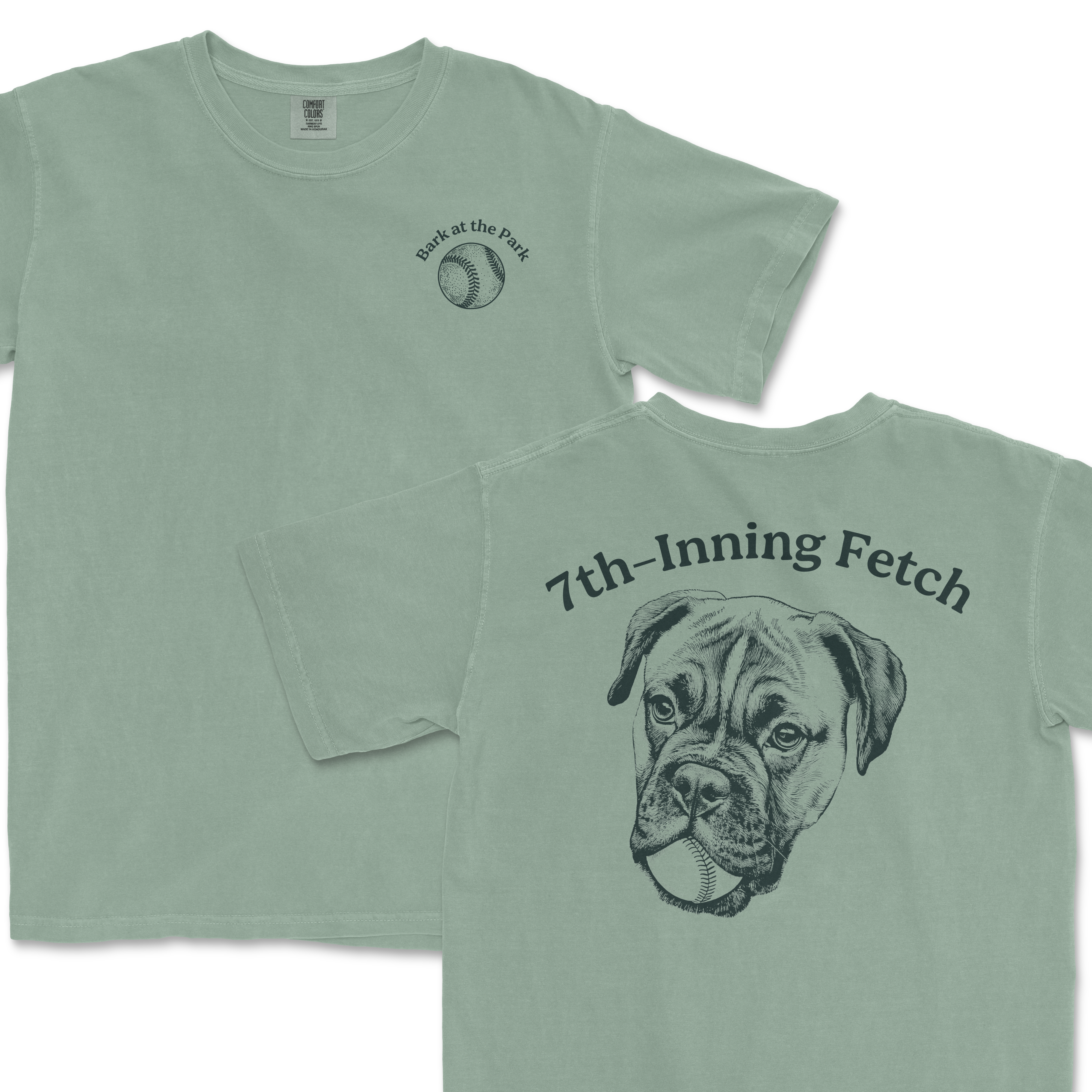 Light green Comfort Colors tee featuring a dog with a baseball in its mouth on the back and a small baseball graphic with "Bark at the Park" on the front.