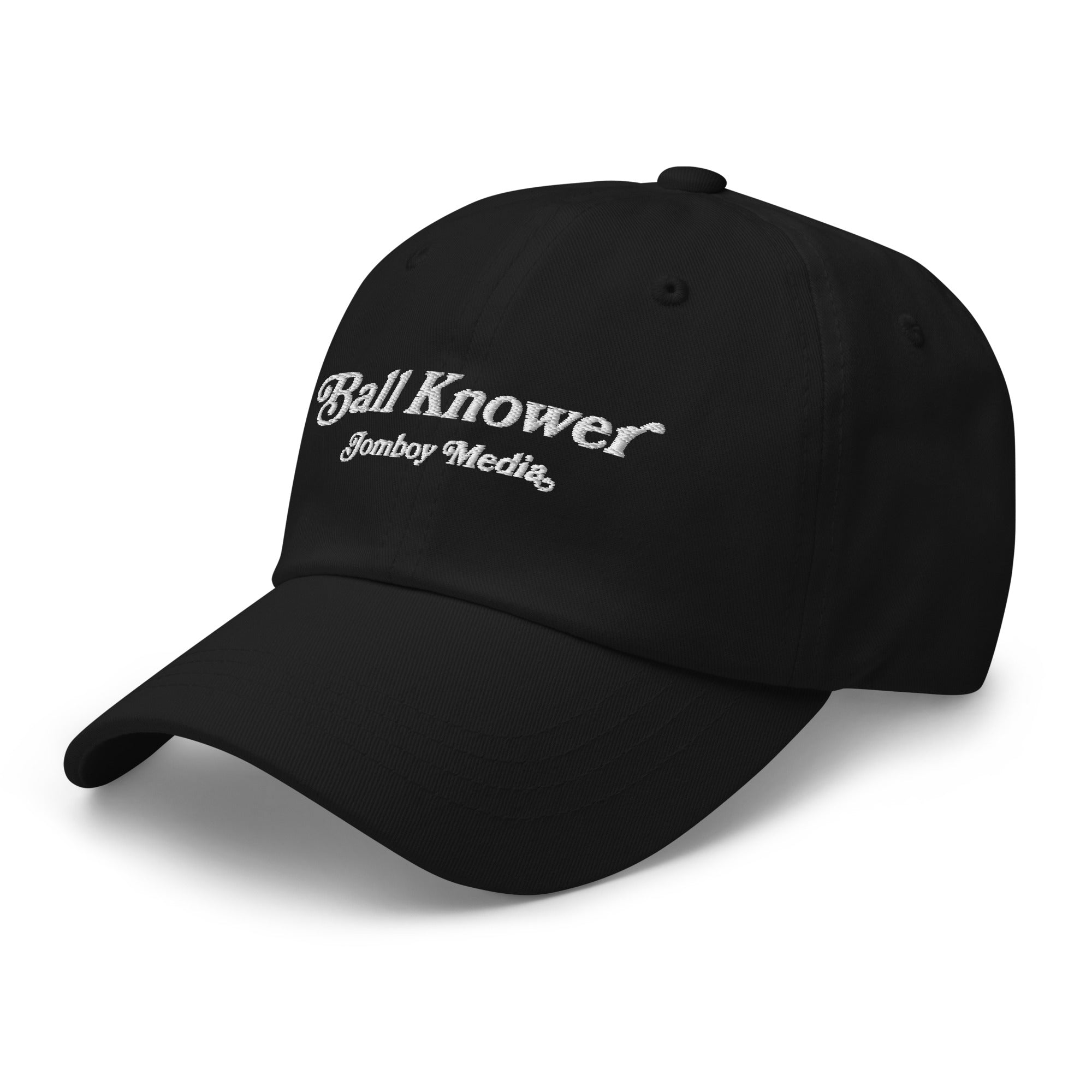 Black dad hat with white embroidered text reading "Ball Knower" and "Jomboy Media" on the front.