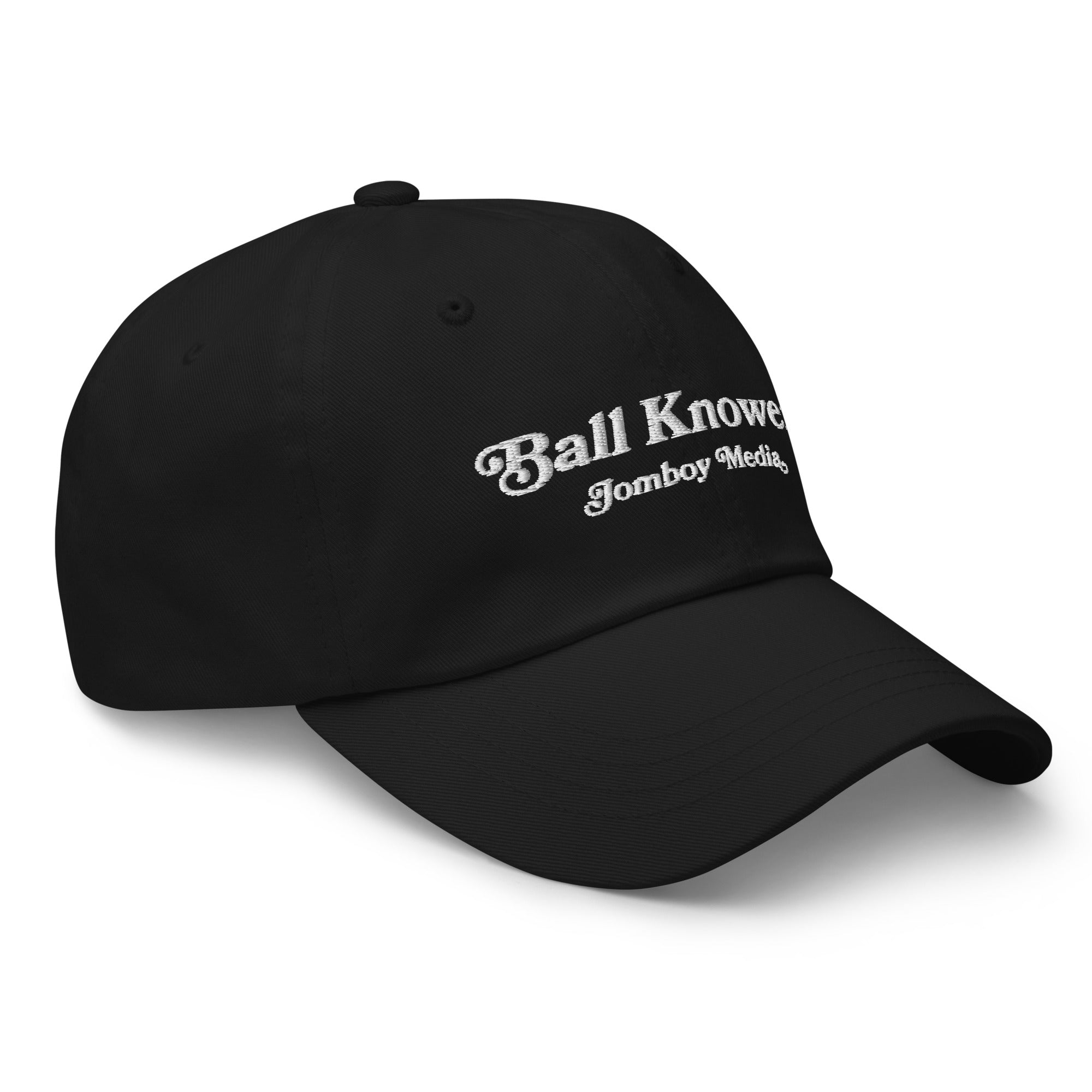 Black dad hat with white embroidered text reading "Ball Knower" and "Jomboy Media" on the front.
