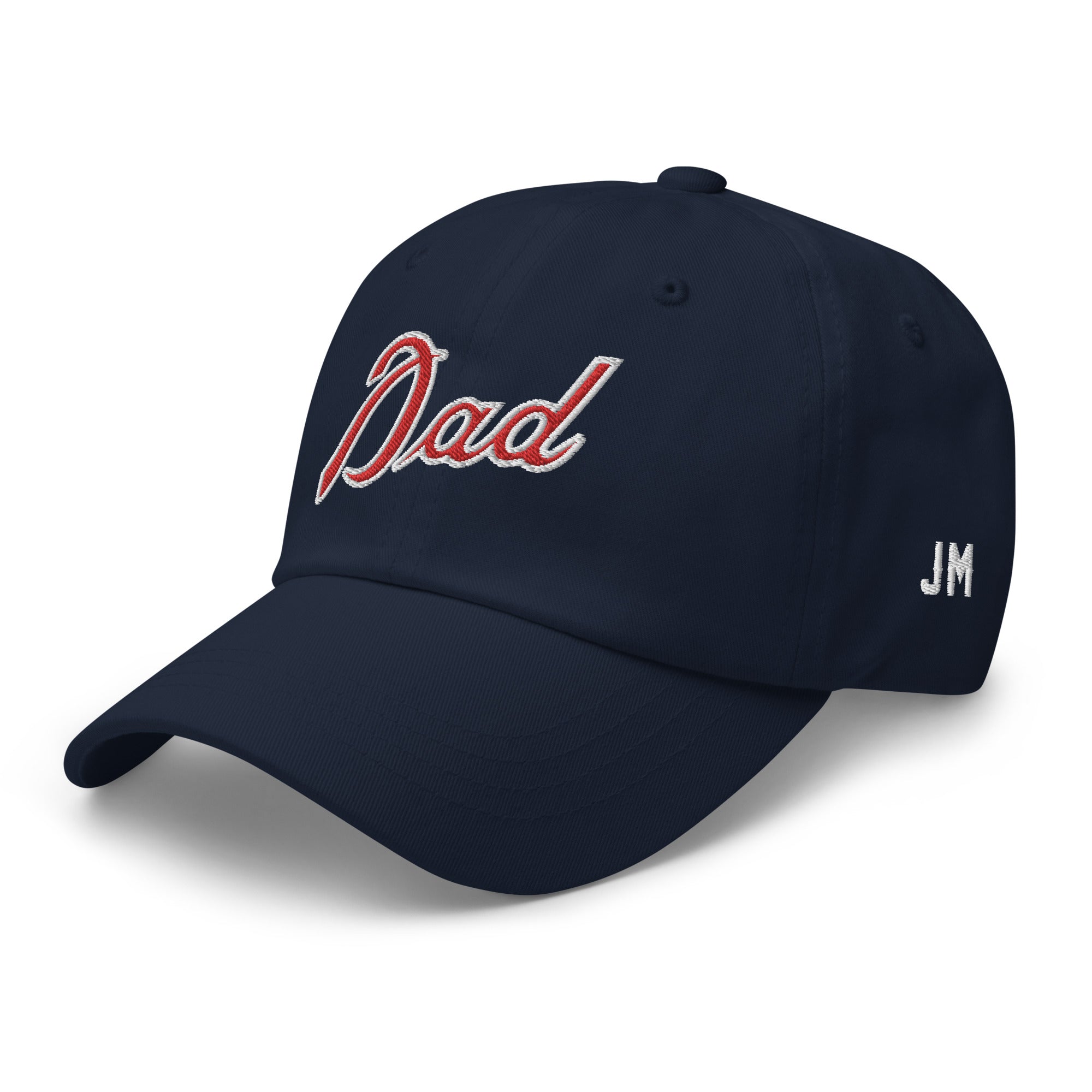 Navy dad hat with red and white embroidered "Dad" text on front and "JM" initials on side.