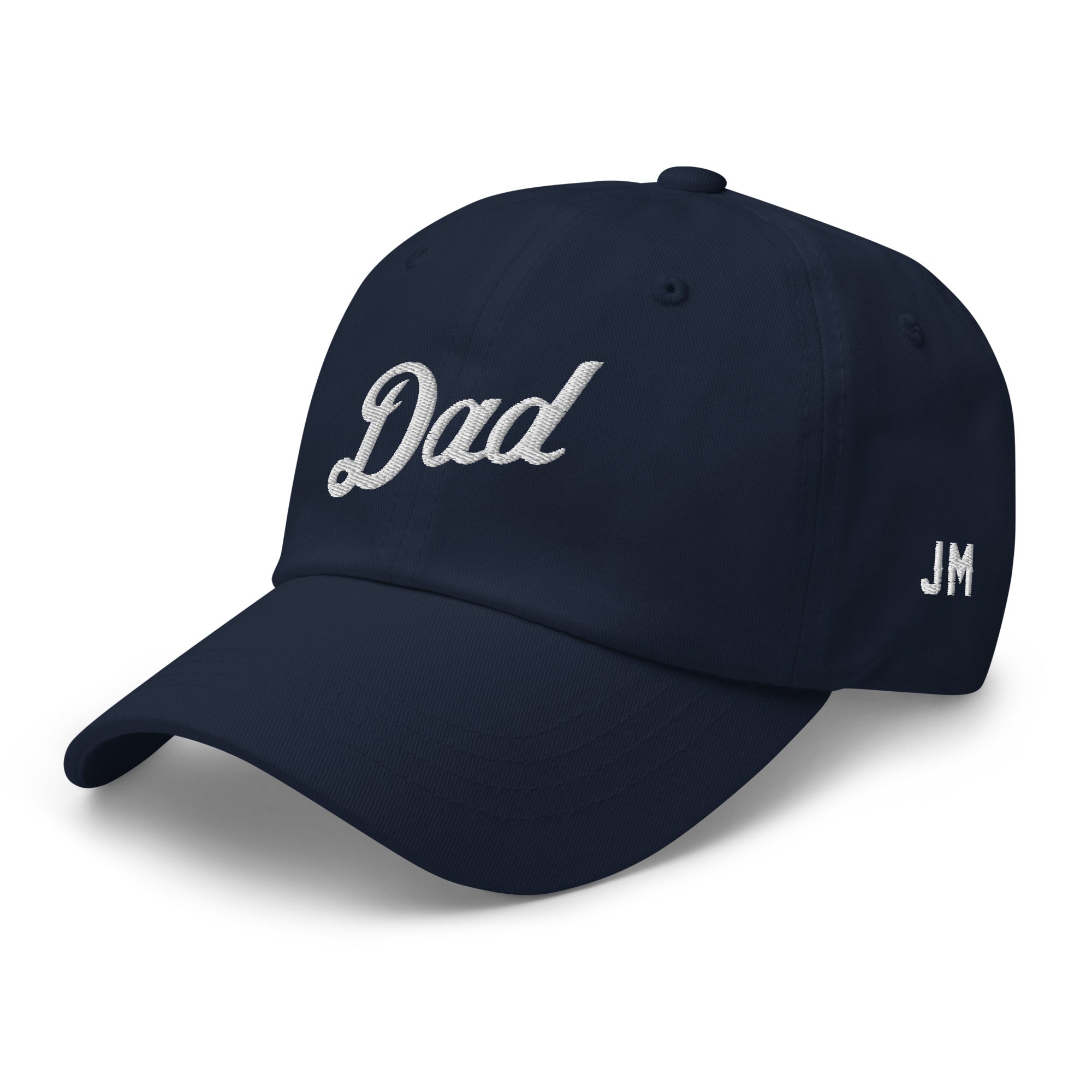 Navy dad hat with white embroidered "Dad" on front and "JM" on side, featuring a curved brim and adjustable strap.