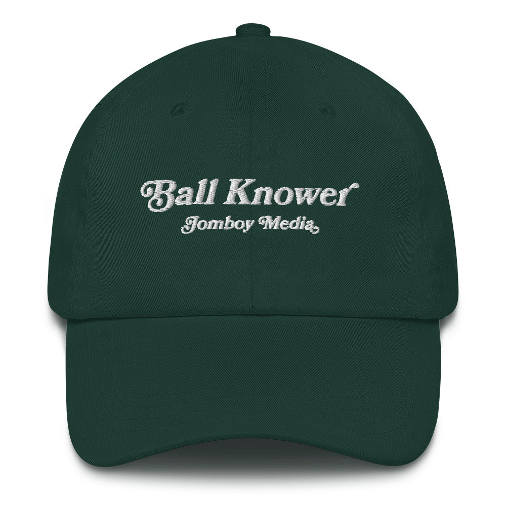 Green dad hat with white embroidered text reading "Ball Knower" and "Jomboy Media" underneath.