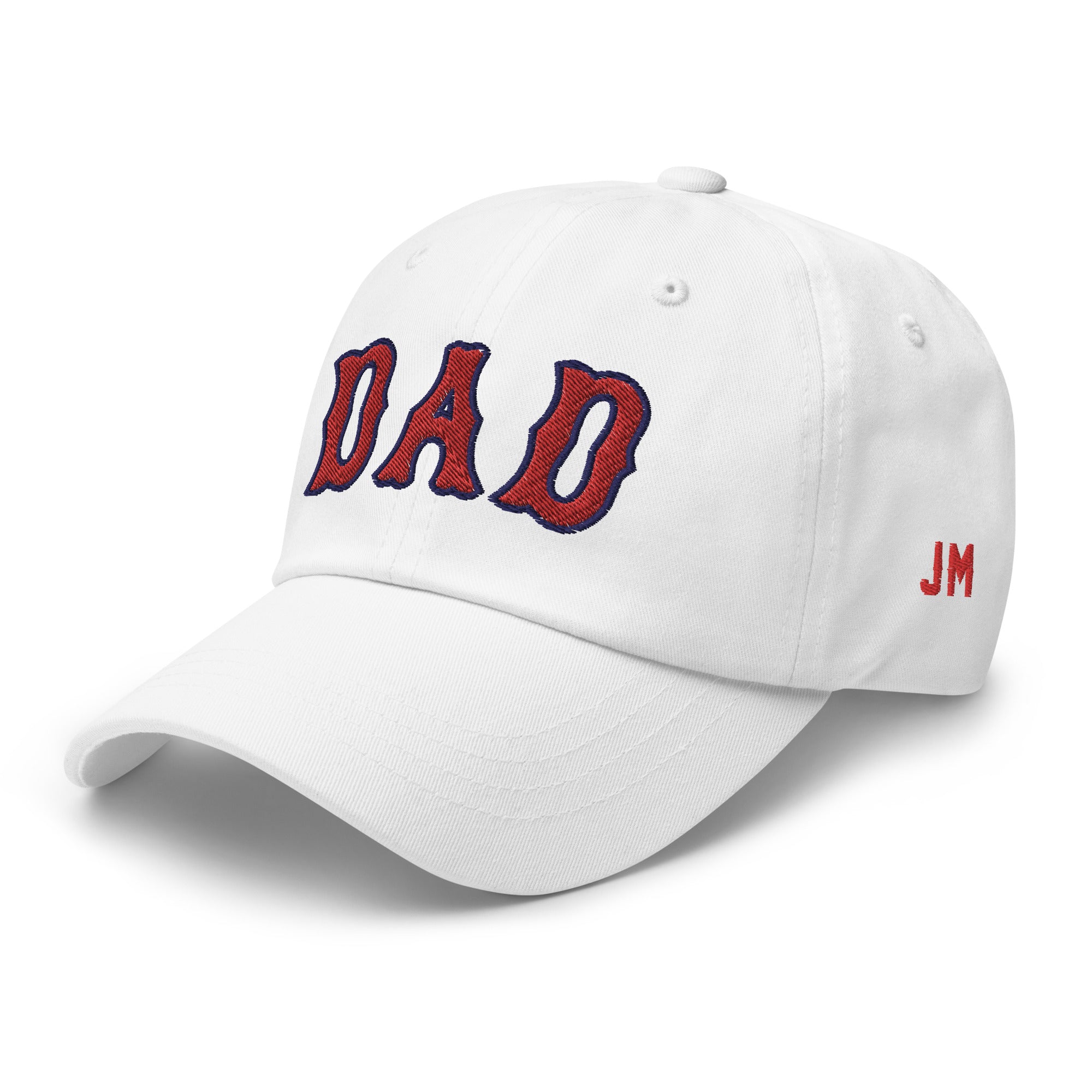 White dad hat with "DAD" embroidered in red and navy on the front, and red initials "JM" on the side.
