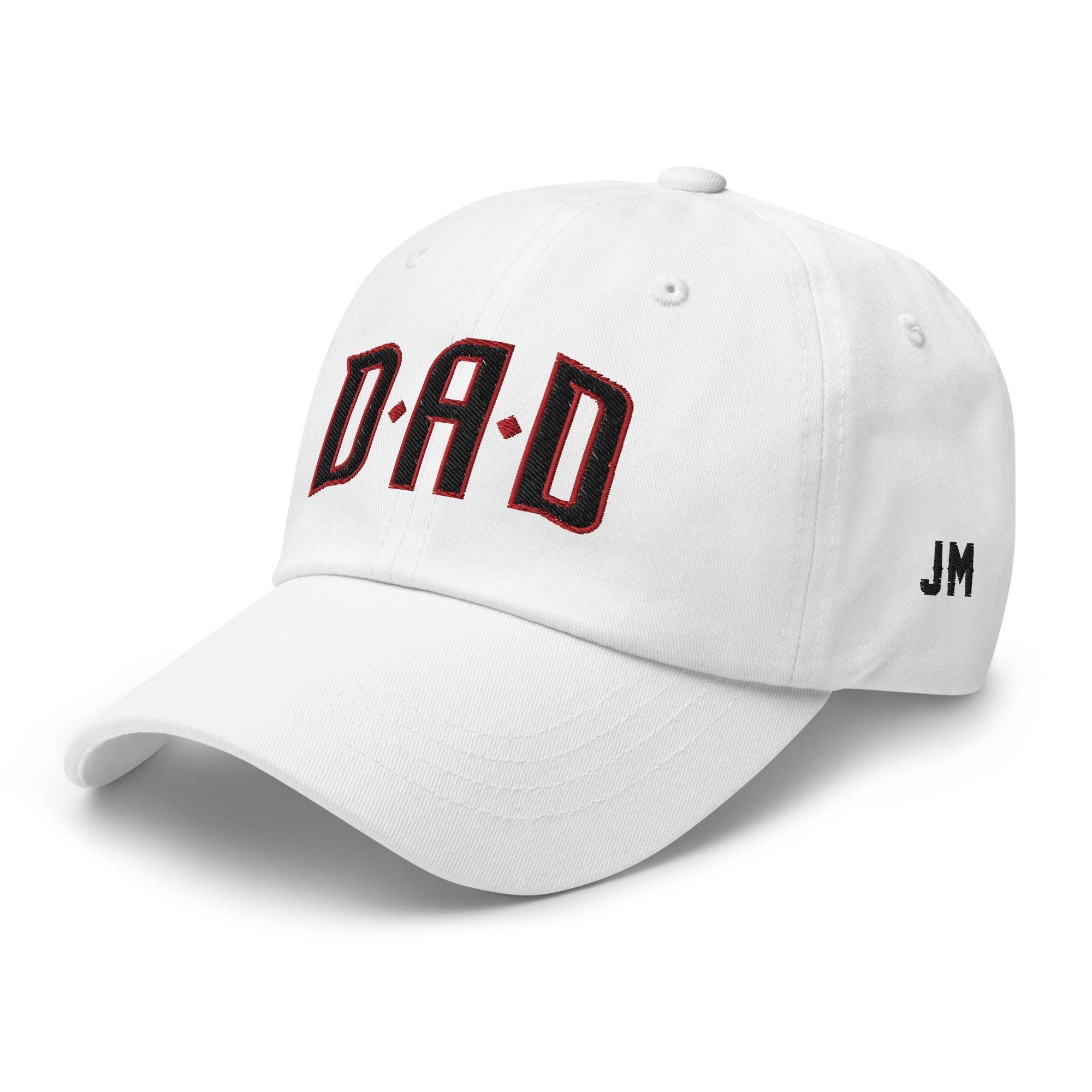 White dad hat with "DAD" embroidered in black and red letters on the front, and "JM" initials on the side.
