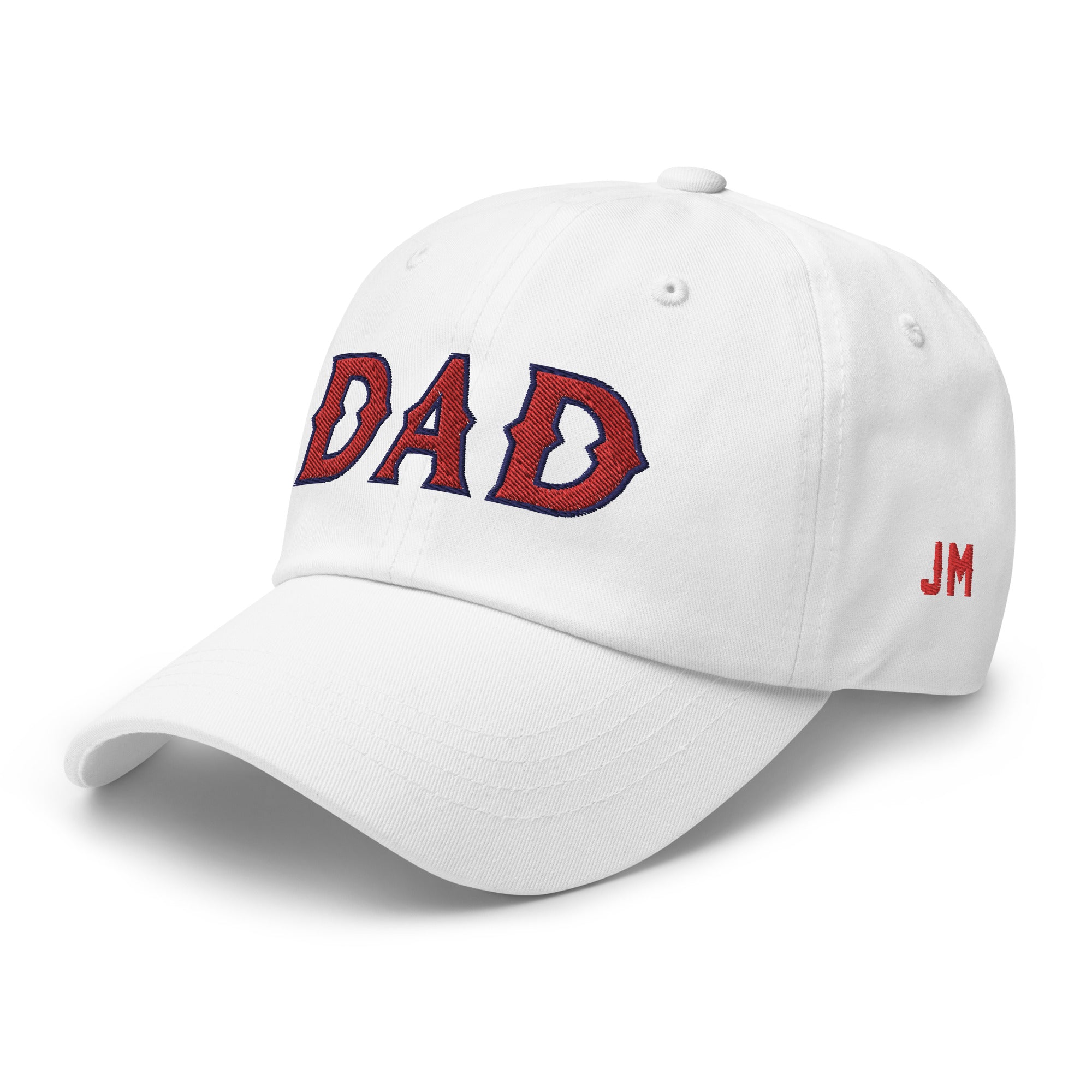 White dad hat with "DAD" embroidered in red and navy on the front, and "JM" embroidered in red on the side.