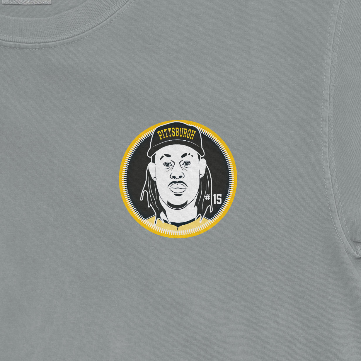 Gray shirsey featuring a circular graphic of a person with dreadlocks, wearing a Pittsburgh cap, and the number 15.