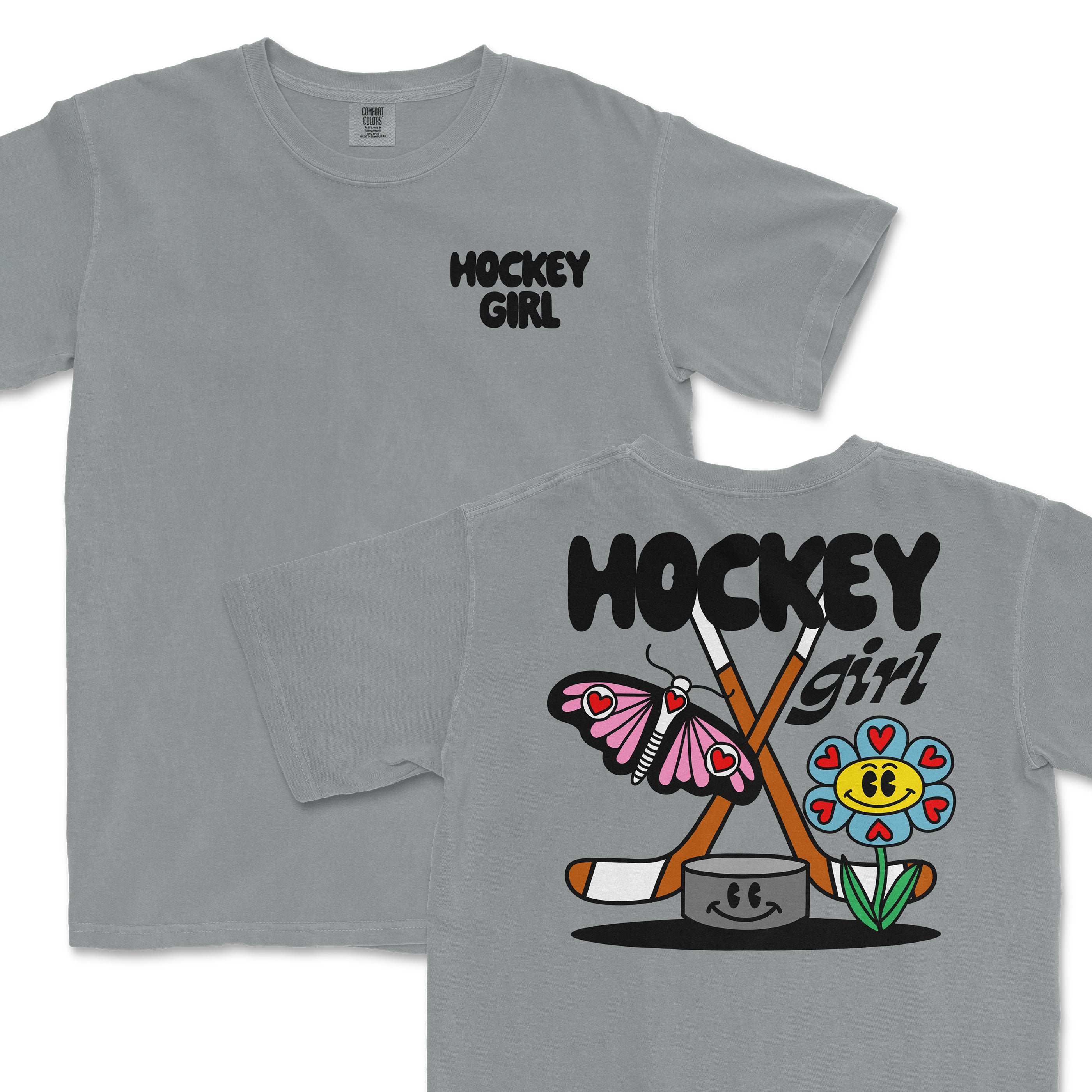 Gray Comfort Colors T-shirt with "Hockey Girl" text on front; back features a colorful cartoon hockey-themed design with a butterfly, flower, and hockey sticks.