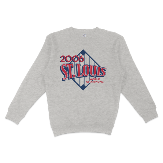 Gray crewneck sweatshirt featuring a vintage St. Louis 2006 World Champions logo with red, white, and blue design elements.