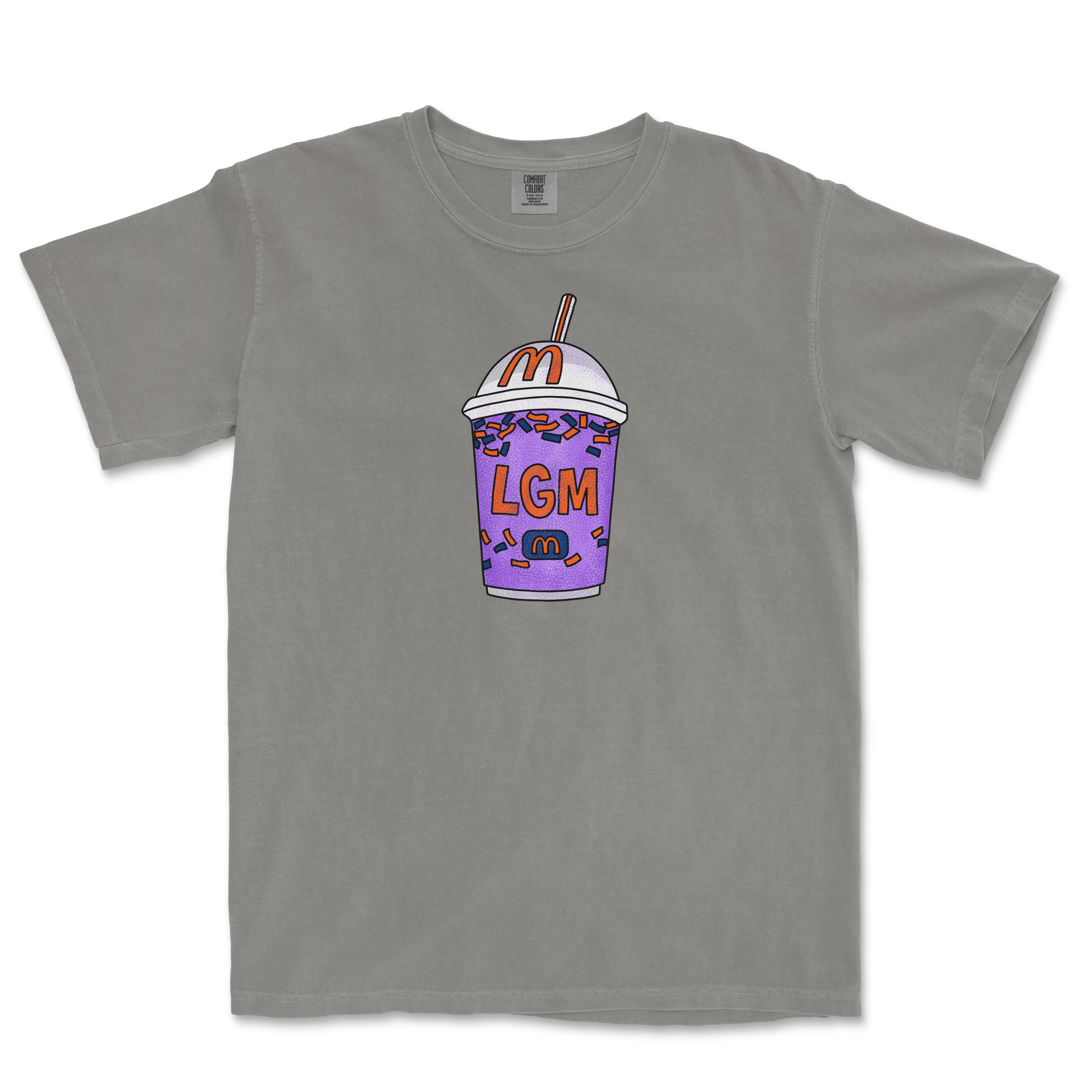 Gray T-shirt featuring a colorful, cartoon-style milkshake cup with sprinkles, a straw, and the text "LGM" on the front.