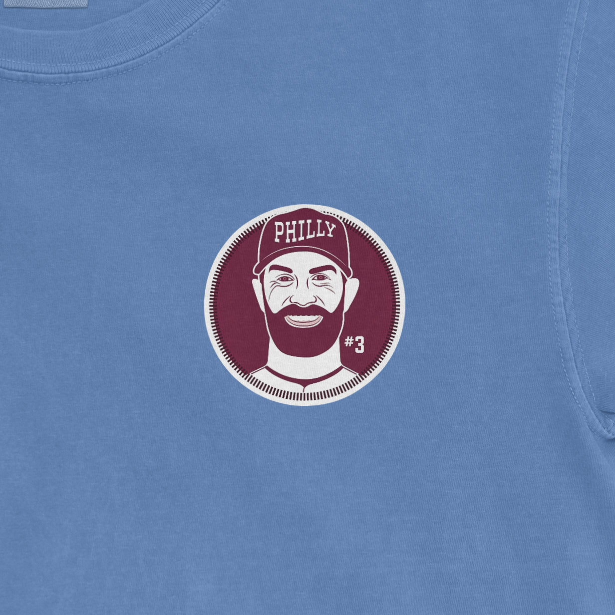 Bryce Harper shirsey Comfort Colors tee featuring a graphic of a smiling man with a beard, wearing a "Philly" cap and #3.
