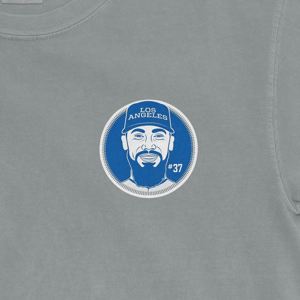 Gray T-shirt with a blue and white Los Angeles-themed graphic of a man wearing a cap, featuring the name, number, and a face illustration.