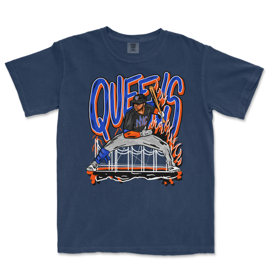 Graphic T-shirt featuring a baseball player in a dynamic pose with flames, graffiti-style text reading "Queens NY" in bold blue and orange colors.