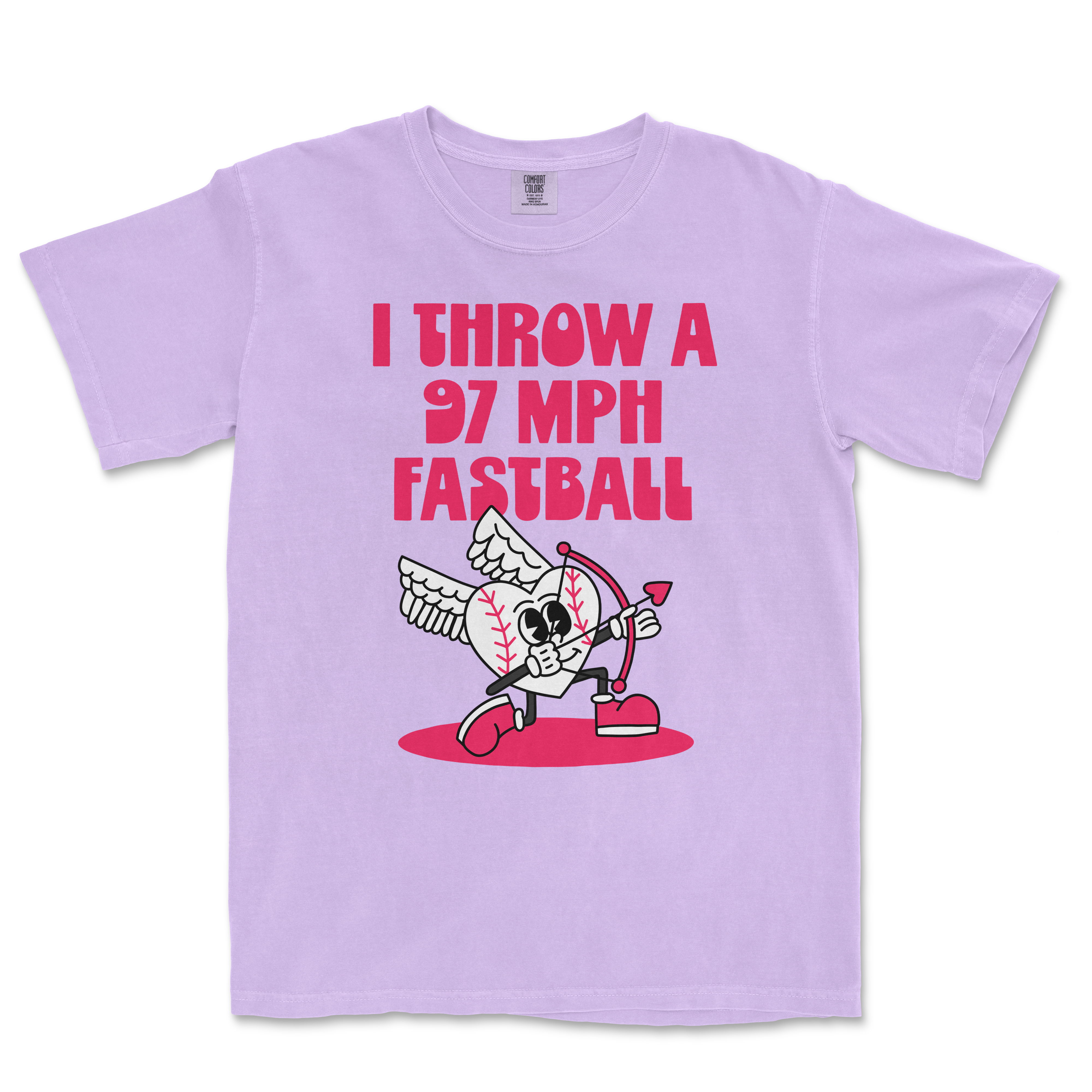 Lavender Comfort Colors T-shirt featuring a cartoon baseball with wings, holding a bow, with bold pink text: "I THROW A 97 MPH FASTBALL.