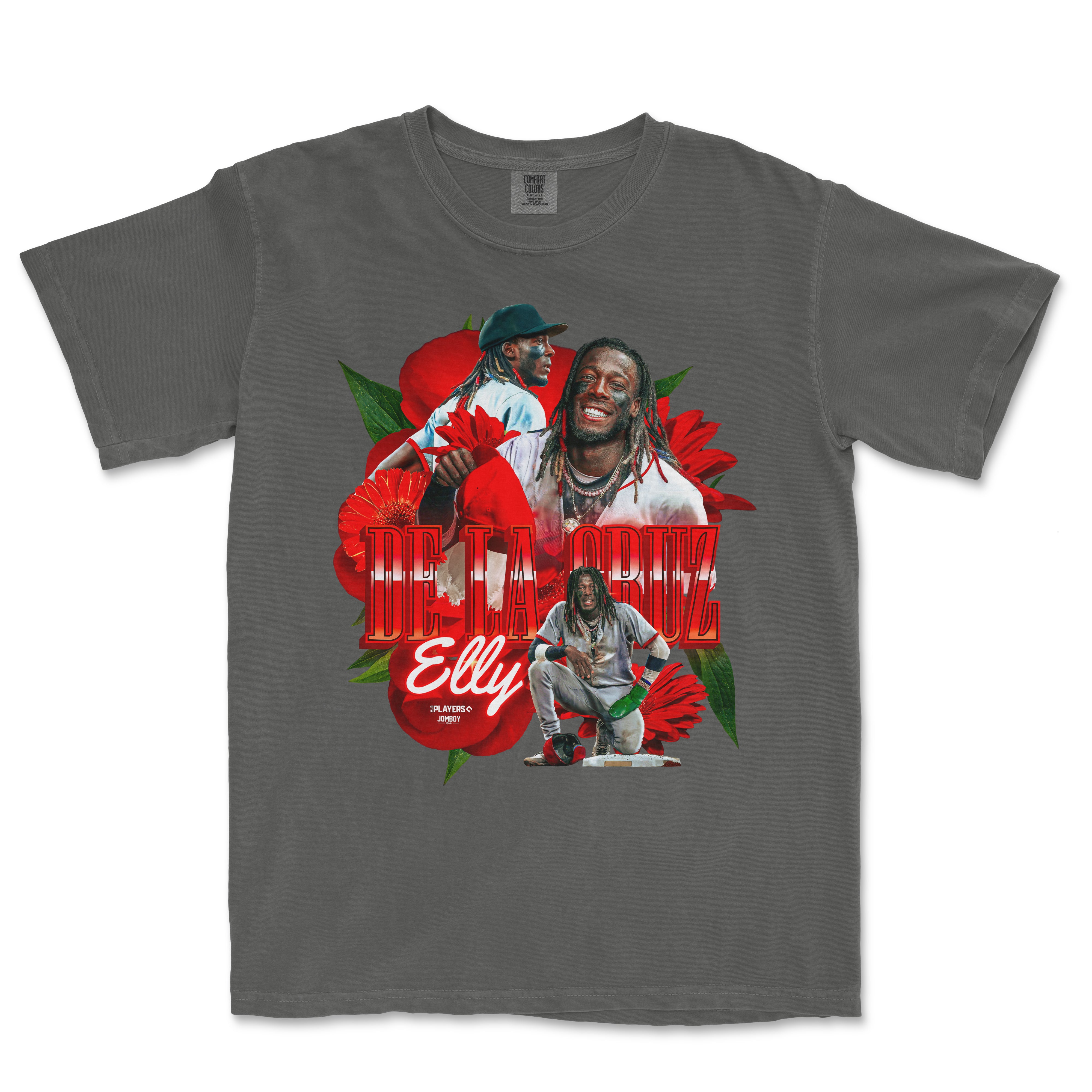 Gray Comfort Colors T-shirt featuring vibrant red flowers, and images of a smiling man with dreadlocks, with "De La Cruz" and "Elly" text.