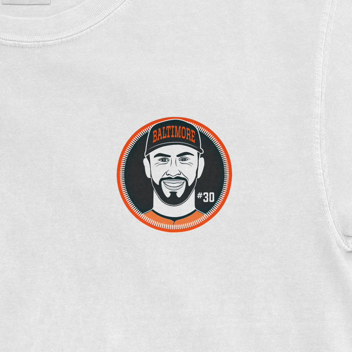 Close-up of a Comfort Colors tee featuring a Grayson Rodriguez Shirsey design with a smiling face, Baltimore cap, and #30.