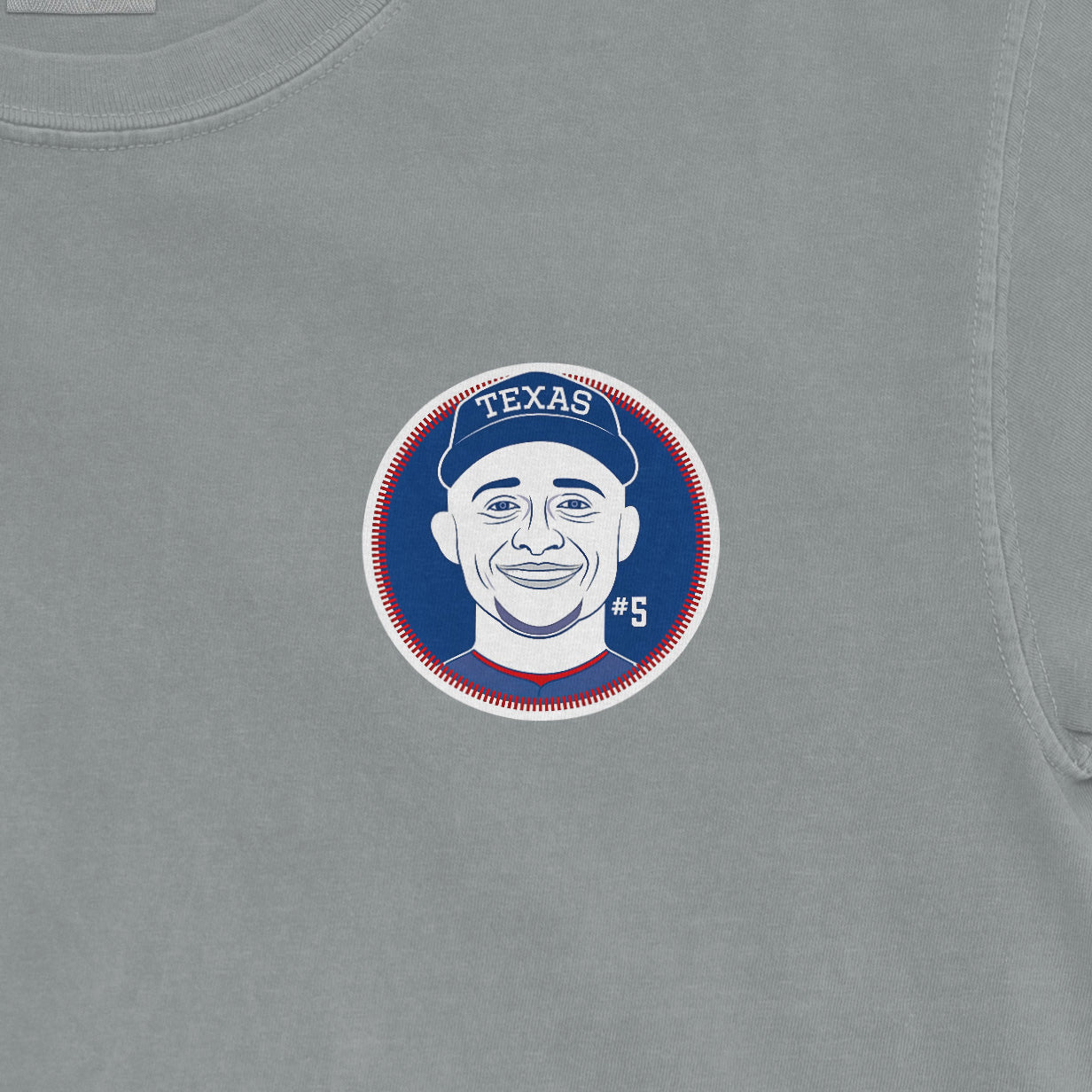 Gray Comfort Colors tee featuring a circular graphic of Corey Seager's illustrated face, Texas cap, and #5 jersey number.
