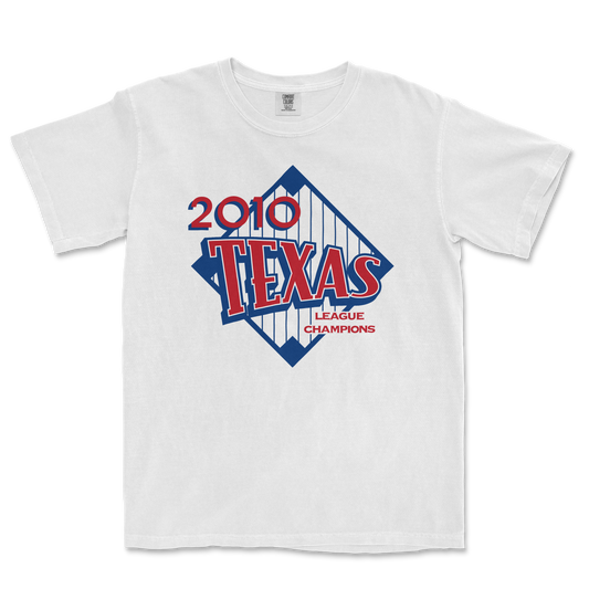 White T-shirt featuring a vintage-style graphic design celebrating the 2010 Texas League Champions, with bold red and blue text and graphics.