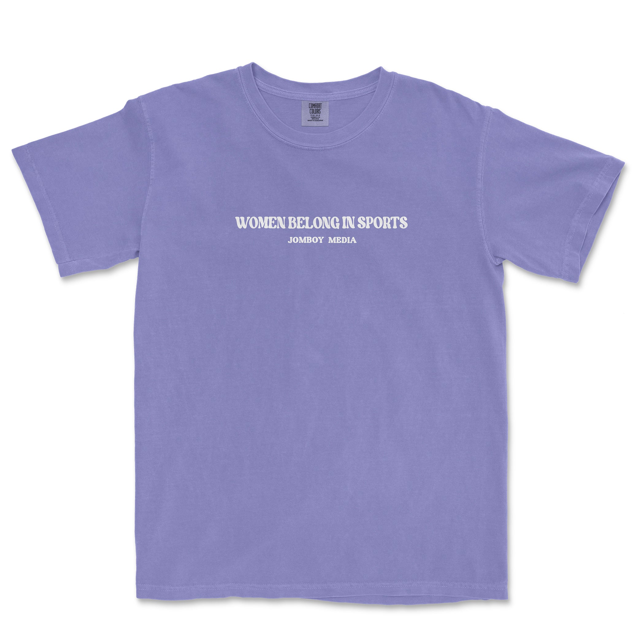 Purple T-shirt with white text reading "Women Belong in Sports" and "JomboY Media" underneath, promoting women in sports.