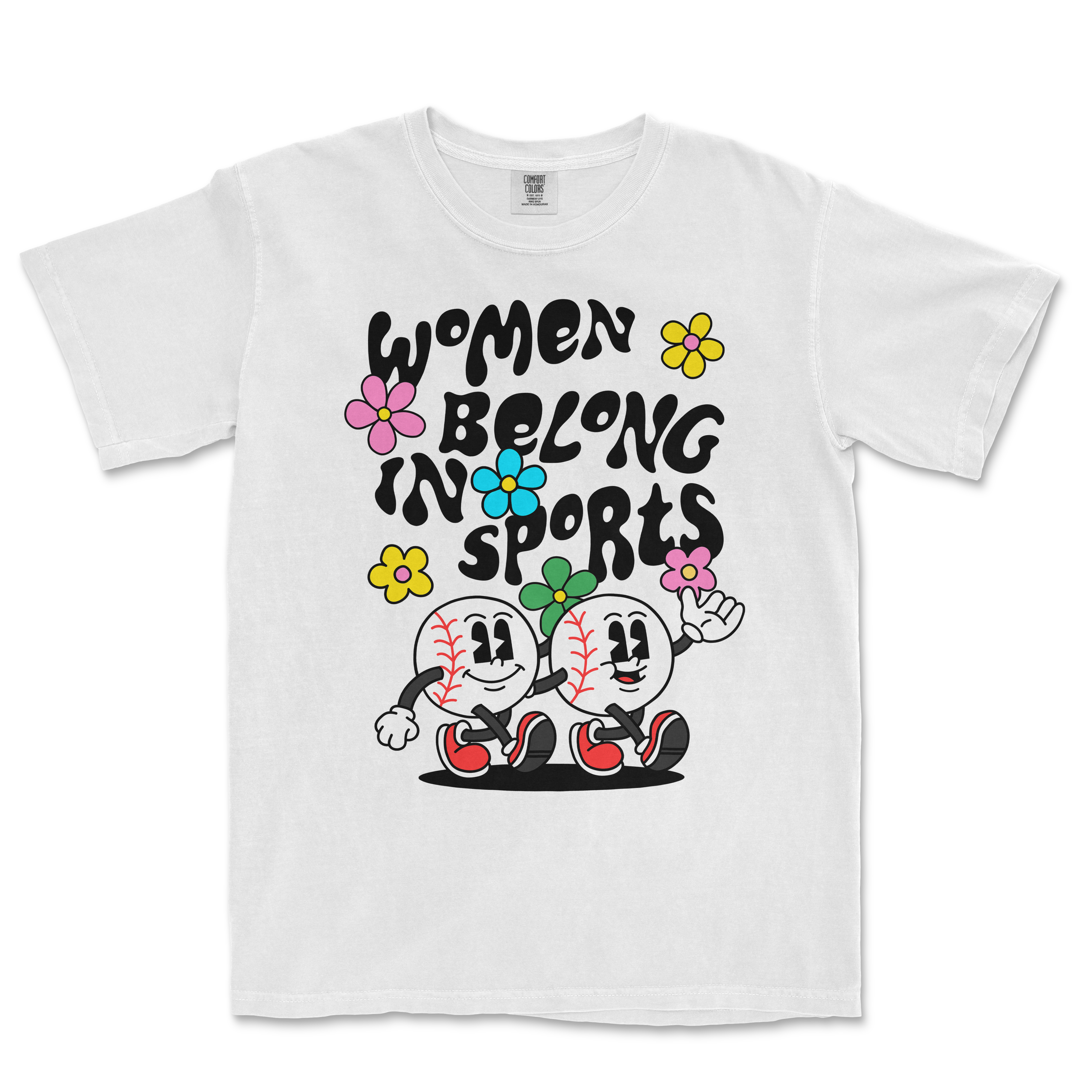 White T-shirt with colorful cartoon baseball characters and flowers, featuring the text "Women Belong in Sports" in bold black letters.