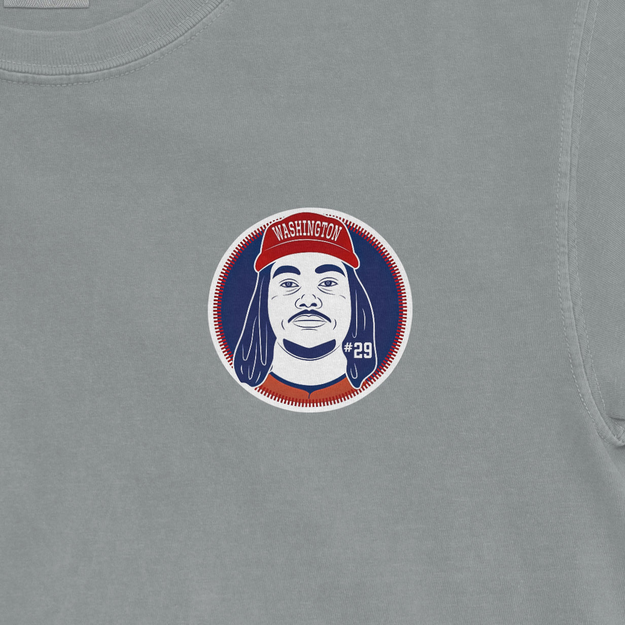 Comfort Colors tee featuring a graphic of James Wood with a Washington hat, #29, on a light gray fabric.