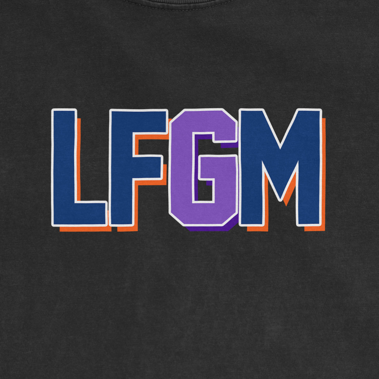 Black Comfort Colors T-shirt featuring bold "LFGM" text in blue, purple, and orange outline, centered on the front.