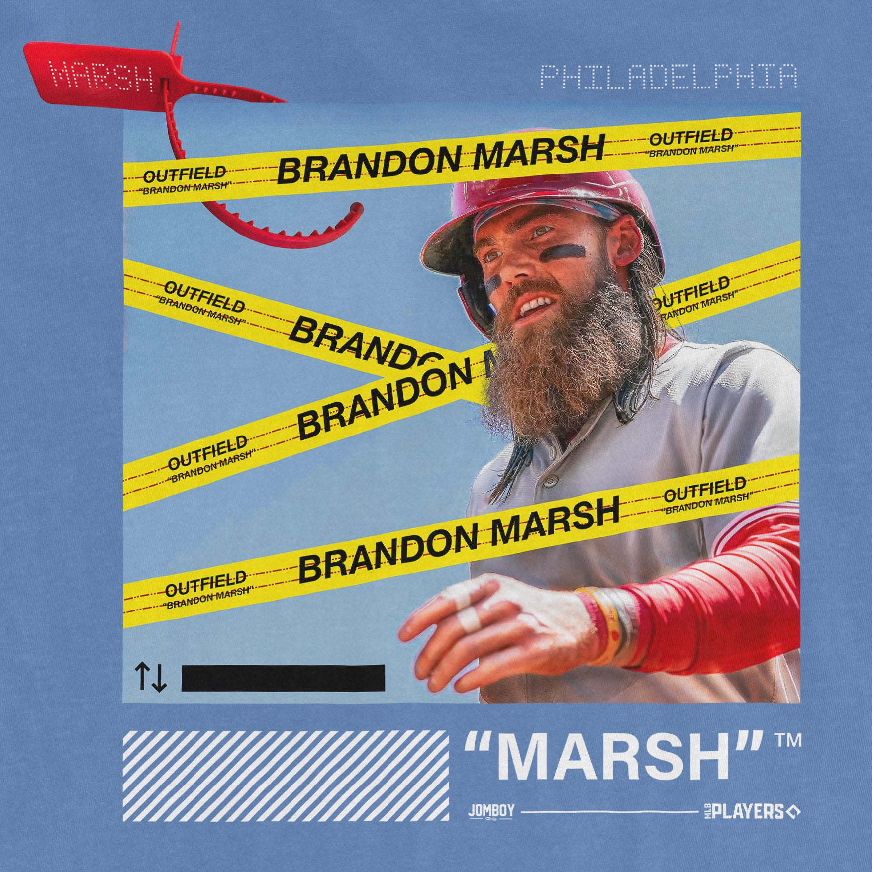 Close-up of a blue Comfort Colors tee featuring a graphic of a man with a beard, helmet, and eye black, surrounded by yellow "Brandon Marsh" tape.